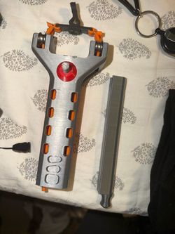 Clip loaded slingshot toy