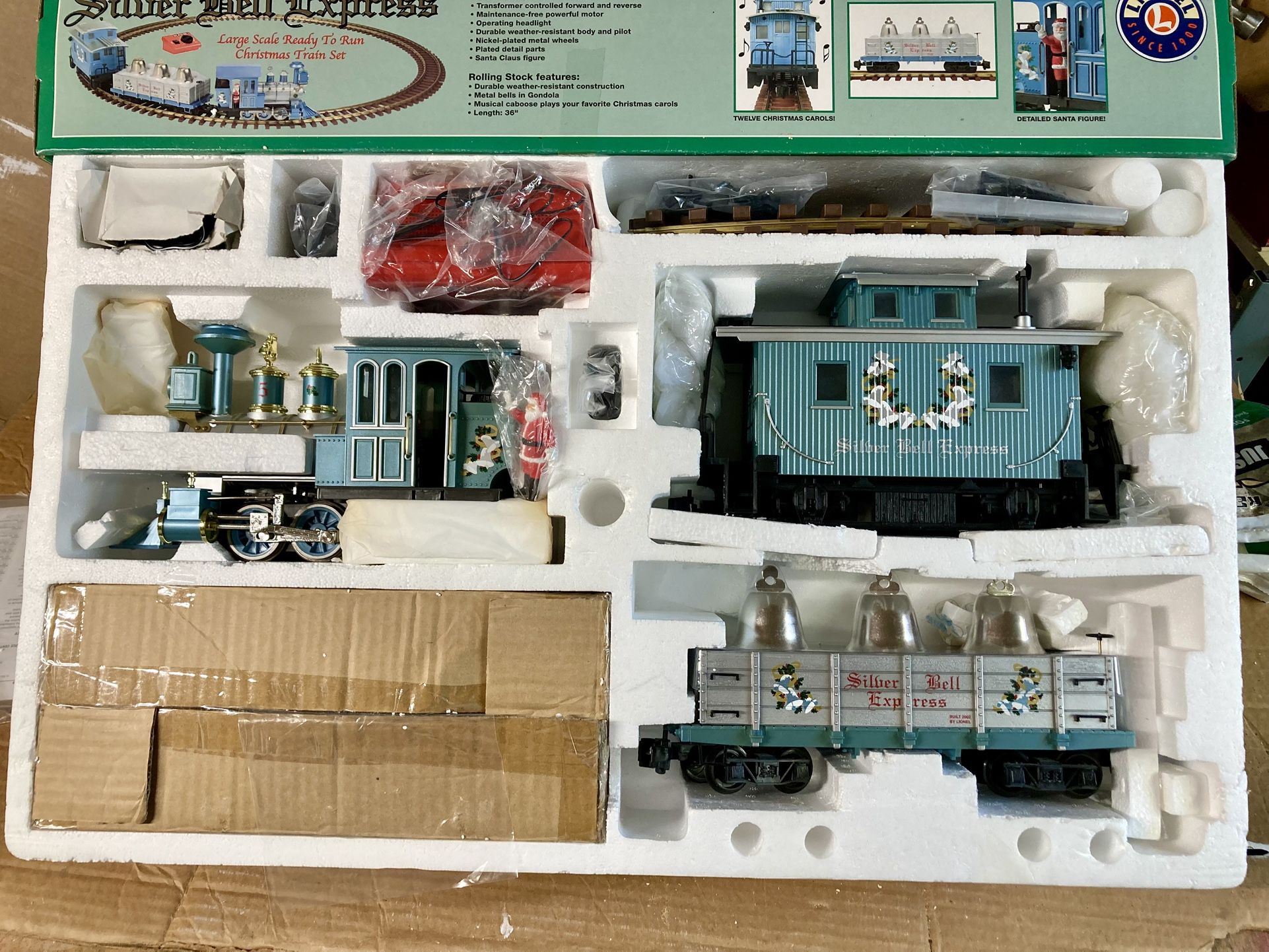 Lionel G gauge Silver Bell Express Christmas train with 12 curve and 4 straight extra track. Plays carols.