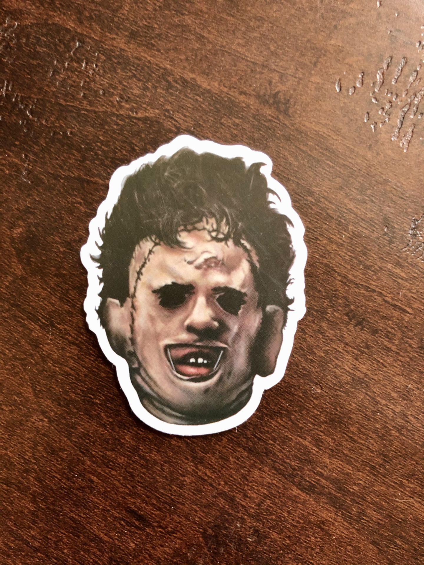 Chainsaw massacre leather face decal sticker. Great for laptops, skateboards, luggage, etc.