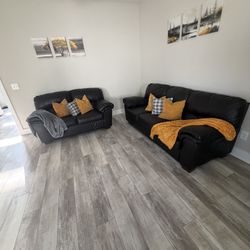 Sofa And Love Seat With pillows And Pictures