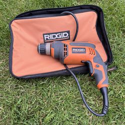 Ridgid electric drill and case 
