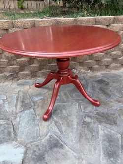 Vintage-Style Round Wood Table – $200