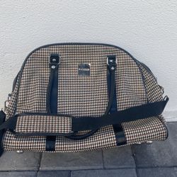 Issac Mizrrahi Carry On Bag Measures 9Lx17Wx13H. Lightweight, and stylish. Carry it over your shoulder or by the handles.