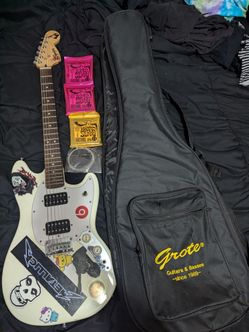 Squier Mustang HH electric guitar, 4 9 gauge strings, and a backpack/carry soft case