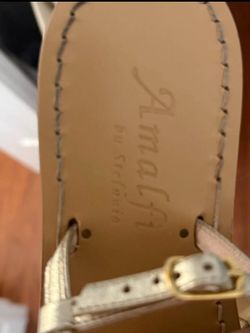 Beautiful Italian leather sandals featuring a unique snake design with green and crystal