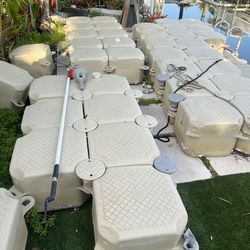 Floating docks cubes sitting on dock ,the other in the water