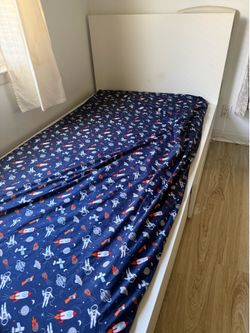 Twin bed with drawers and mattress