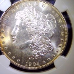 1904‑O Morgan MS65 (NGC) Beautiful Coin With Warm Gold Edge Toning