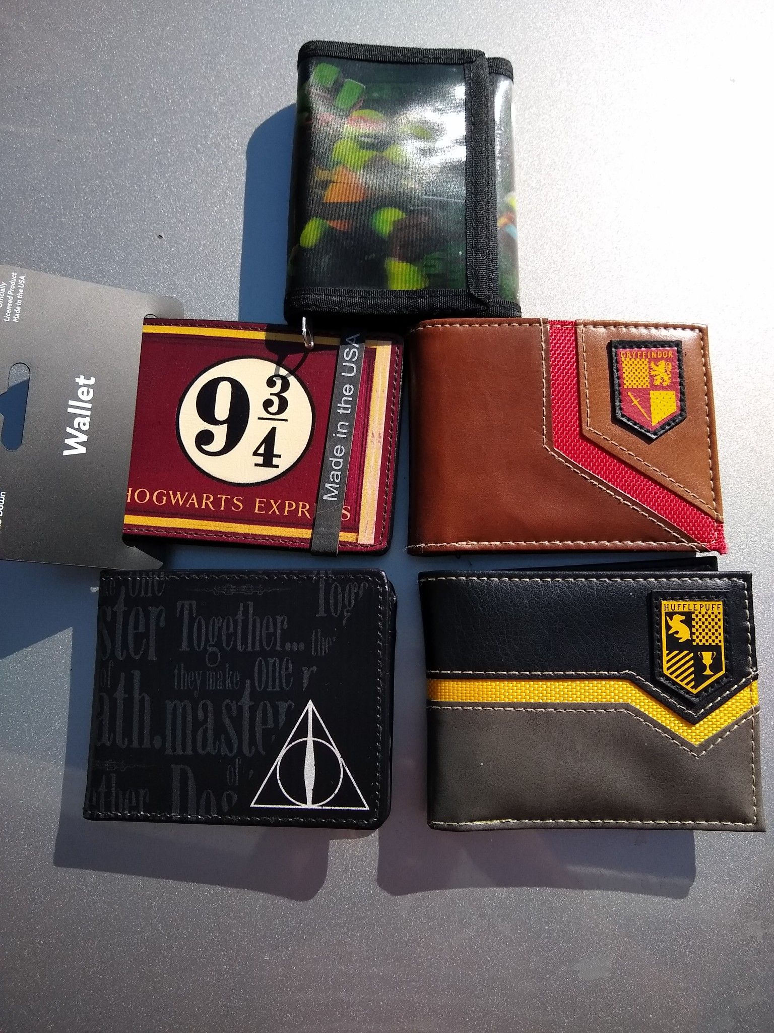 Genuine Harry Potter wallets, and 1 Ninja Turtles. New