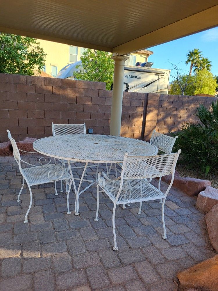 White rod iron table very heavy $300 needs paint.When I paint it