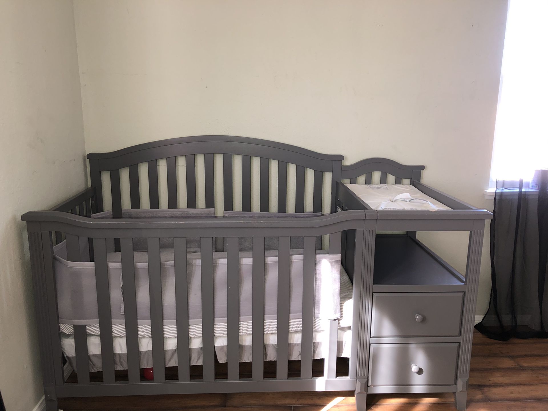 Convertible crib and changing table with mattress included