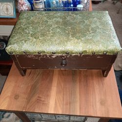 Early wood and vinyl top brass studied all original foot stool with draw