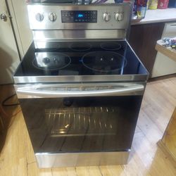 Excellent Working 5 Burner Samsung glass top stove with Dual Function self-cleaning Convection oven in good condition
