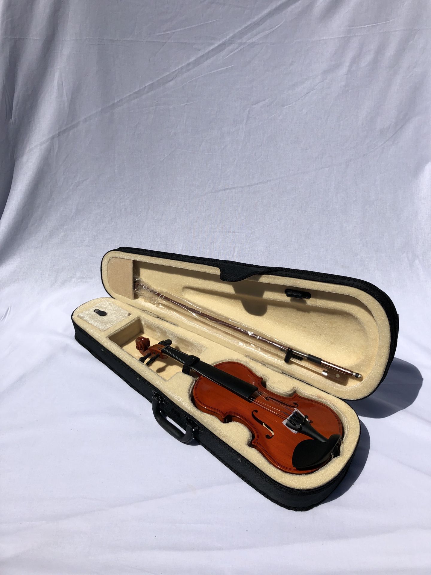Brand new natural wood colored violin
