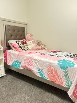 Grey twin bed with LED headboard