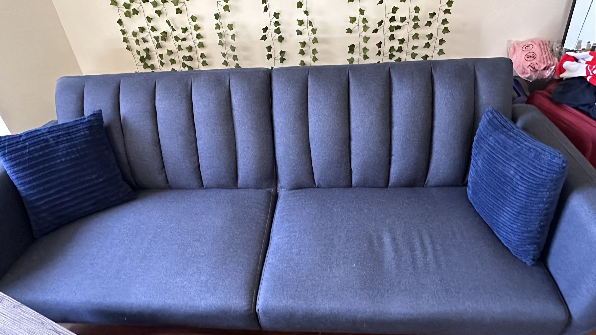 Blue Sofa Bed with Pillows