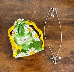 Brighton anchor, star and pearl-like charms.