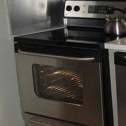 30 inch GE  4 burner, glass top, electric stove top range