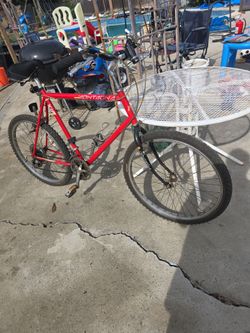 VintageMontagna X15 mountain bike. Not sure if it shifts correctly. Never rode it myself.
No kick stand. Grips need attention