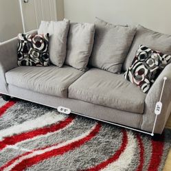 Couch And Rug With Throw Pillows 