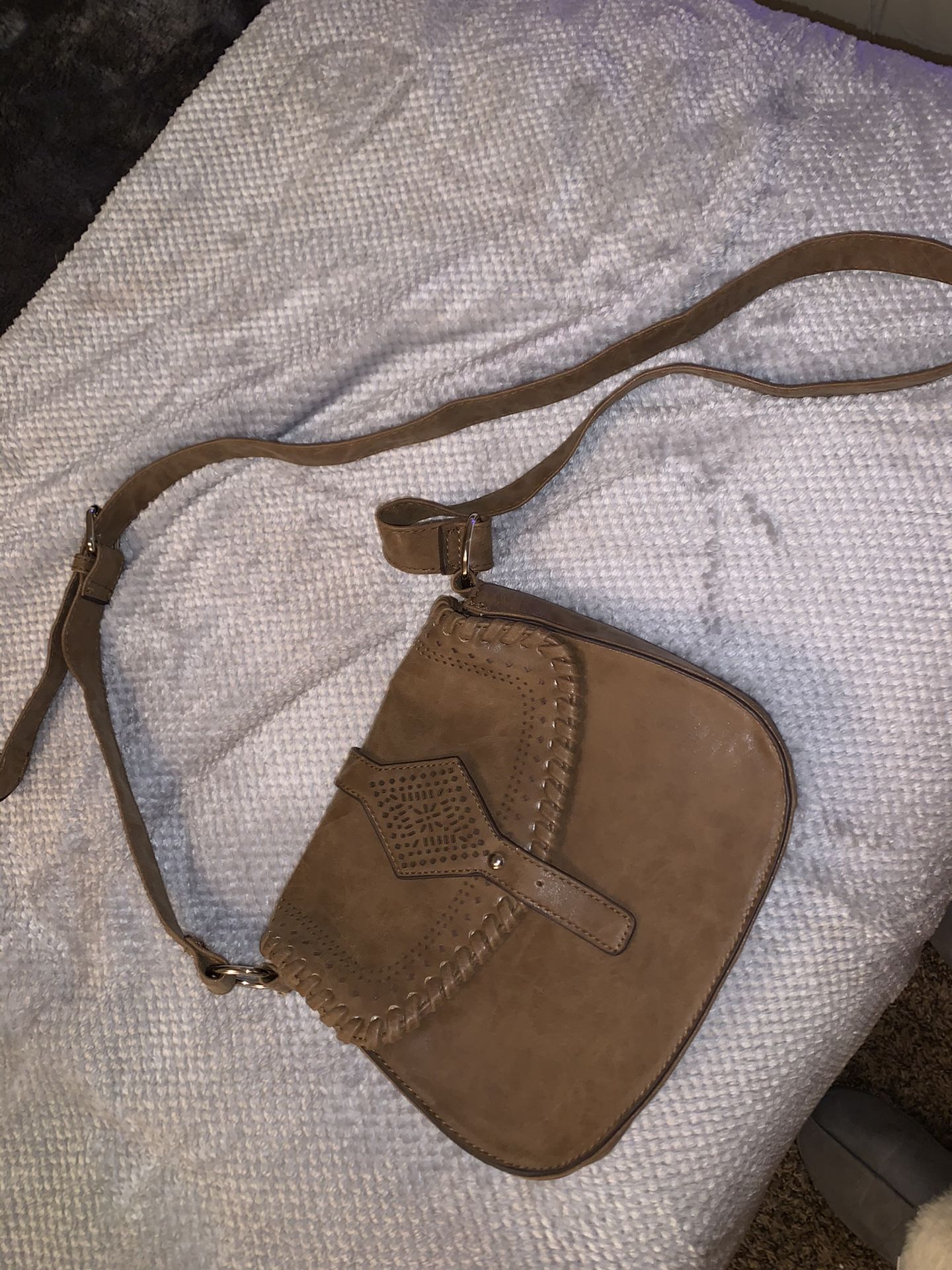 small brown purse with adjustable strap