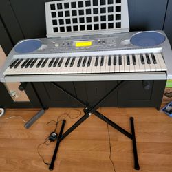 Yamaha Piano Keyboard With Touch Sensitive Keys And Stand