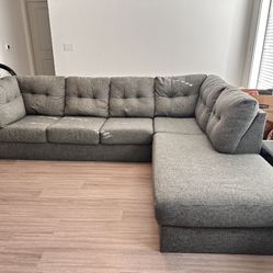 Gray Arrowmask 115” by 90” 2pc Modern Sectional Sofa with RAF Chaise by Living Spaces