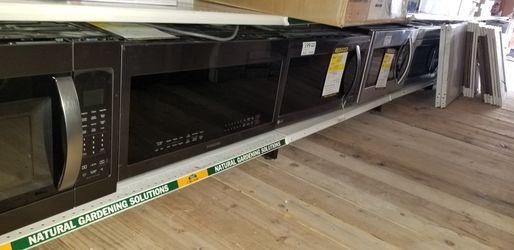 BRAND NEW over-the-range microwaves... LG.. Whirlpool, Samung, and GE