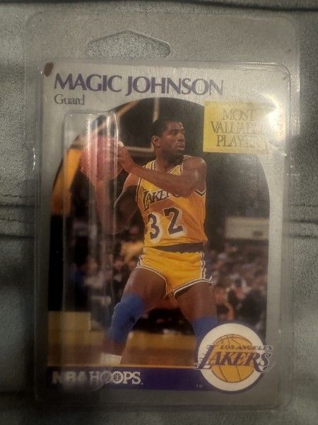 1990-91 NBA Hoops Magic Johnson Card
The basketball card shown is the 1990-91 NBA Hoops #157 Magic Johnson card. This card features Magic Johnson of t