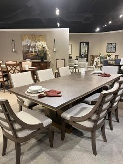 Modern Design dining set features brown & gold finish w/trestle base