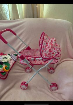 Pink toy stroller