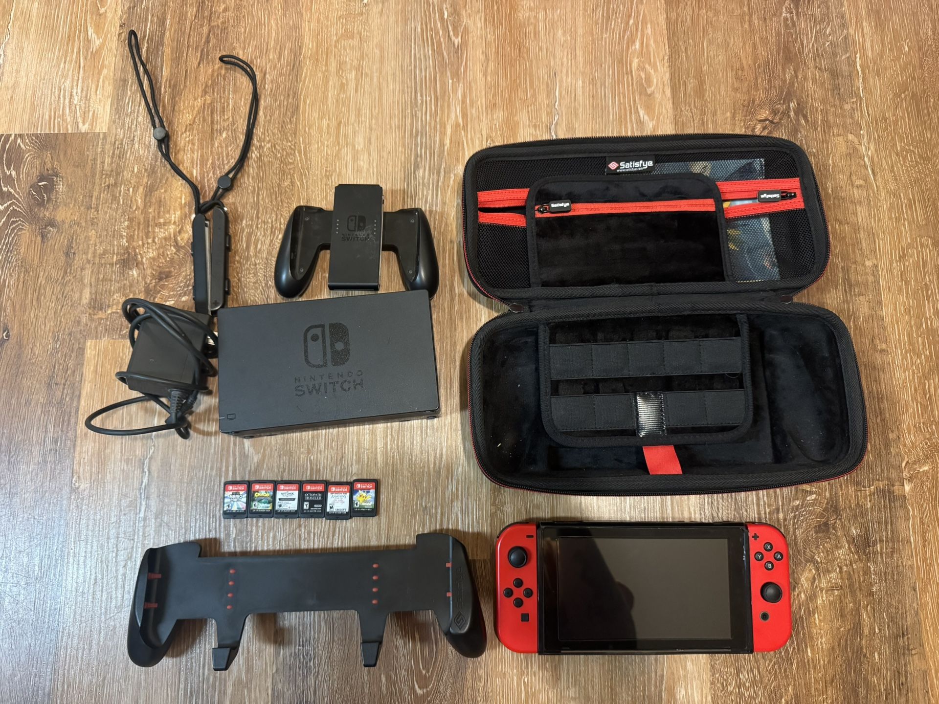 Nintendo Switch 1 Gen 2 with Case, Grip, And Games