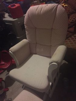 Rocking chair and ottoman and diaper changer and more strollers and baby stuff