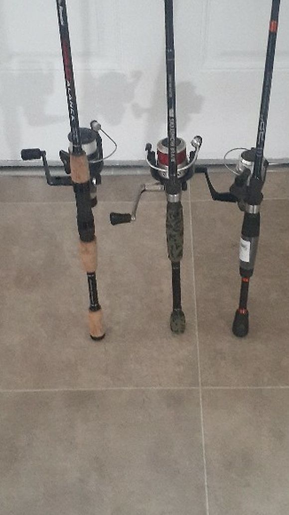 Three fishing poles with reels all working