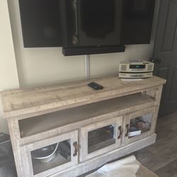 Entertainment center tan wood glass doors