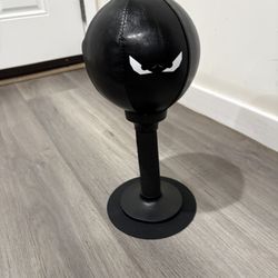 Black freestanding reflex punching ball