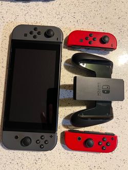 Nintendo Switch with 4 joy cons, 8 games, dock w/ ac adapter and more