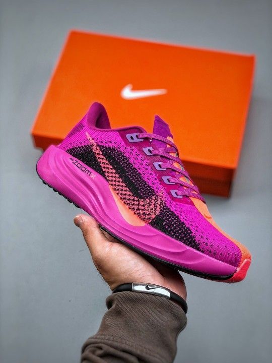 Pink Nike shoes designed by the designer