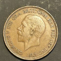 The image shows a 1930 British one penny coin. Key details include: Denomination: One Penny. Country: Great Britain. Year: 1930. Ruler: George V. Com