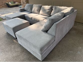 Living Spaces U shape sectional with storage ottoman and queen memory foam mattress