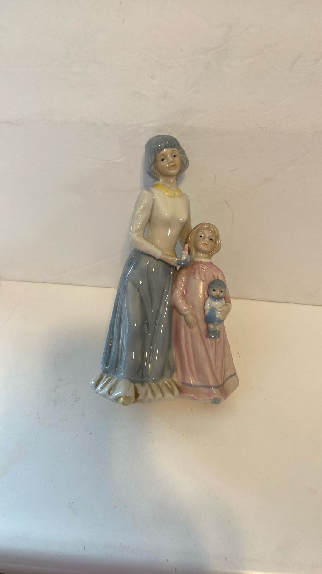 Mother with child. 9 inches tall. $10.