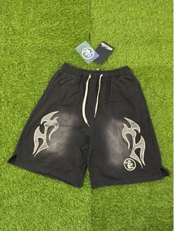 Hellstar black shorts with white flame graphic