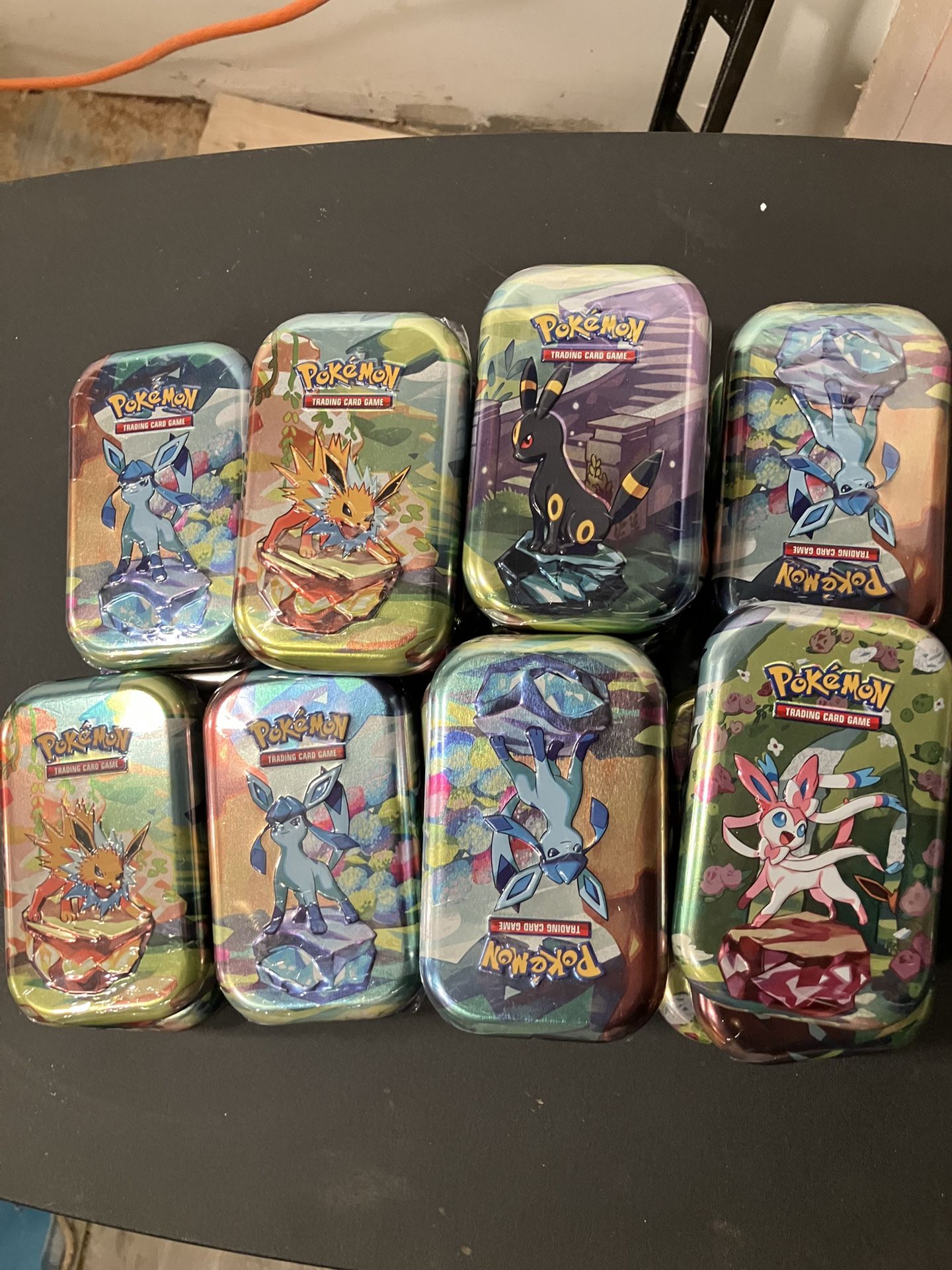 Pokémon Prismatic Tins