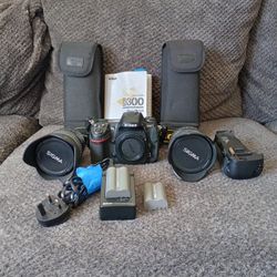 Nikon D300 DSLR camera body bundled with a Sigma lens and accessories