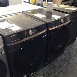 Samsung Front Load Washer And Gas Dryer In Black Steel With Chrome Detail 