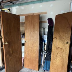 Three Hinged Doors With Knobs