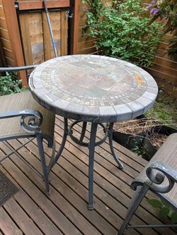 Tall patio table and two chairs