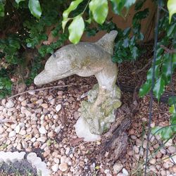 Heavy concrete dolphin spitter