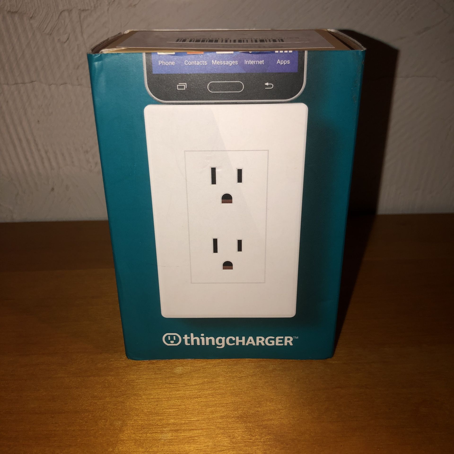 New Thing Charger. It plugs into a regular outlet and has two outlets and a micro usb charger outlet on the top