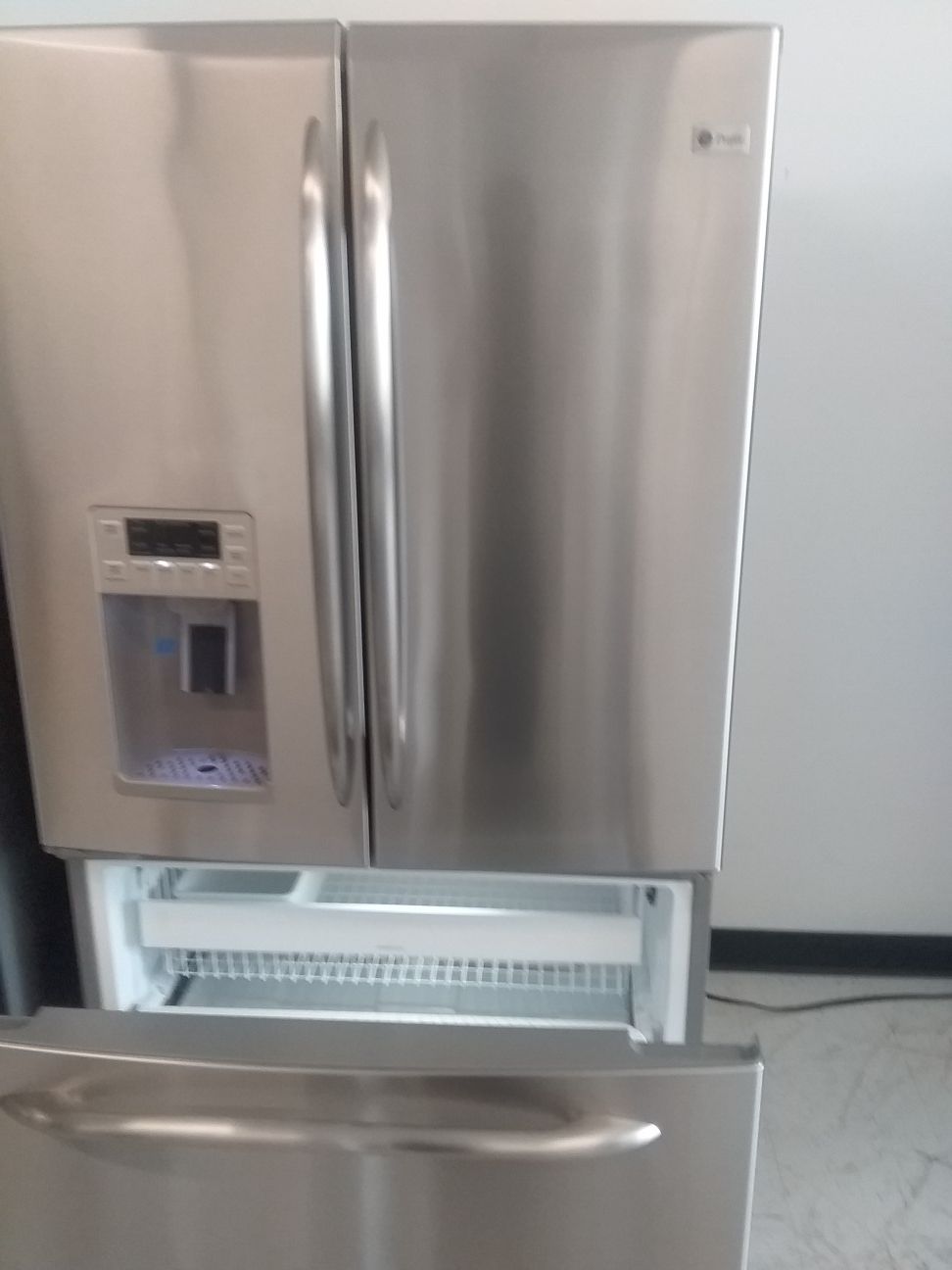 Ge French doors stainless steel refrigerator used good condition 90days warranty